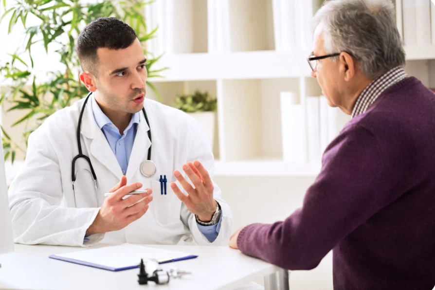 Doctor discussing fentanyl detox Georgia treatment options with an older patient.