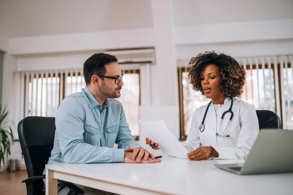 Clinician reviewing paperwork with a patient during fentanyl detox Georgia treatment.