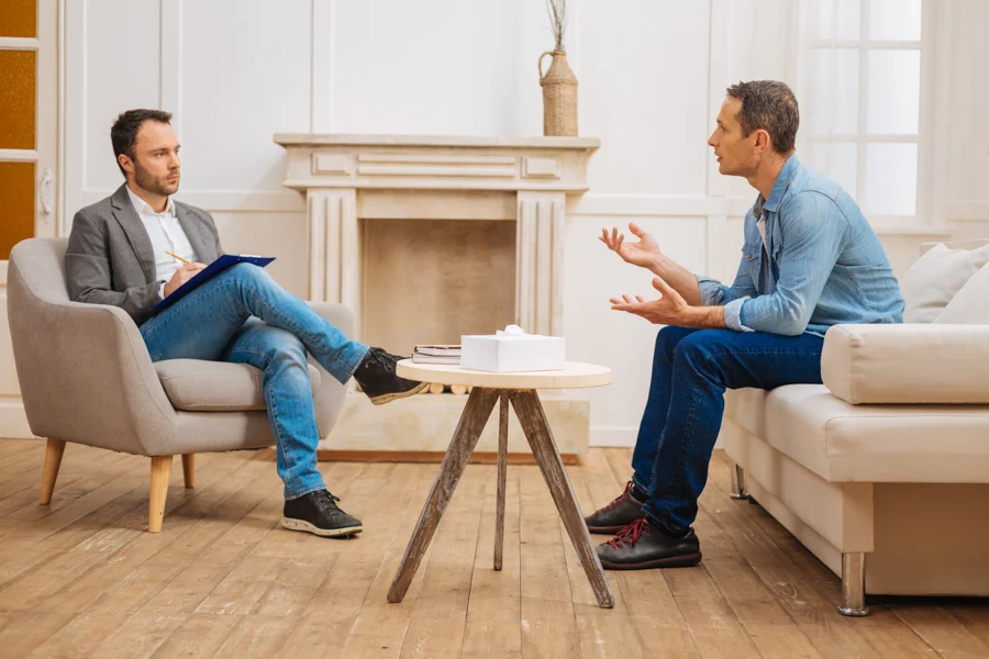 psychologist conducting a therapy session with a patient in medical detox program