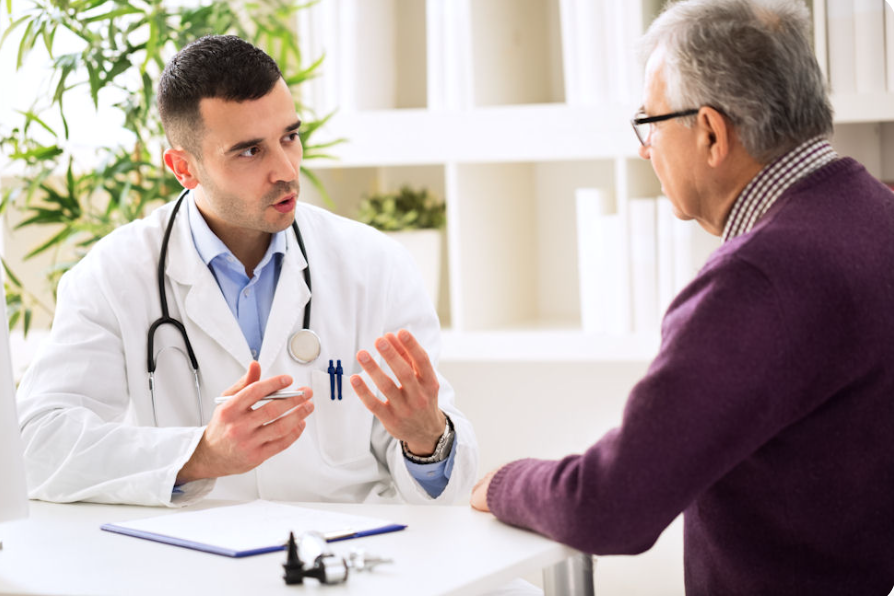 Doctor discussing fentanyl detox Georgia treatment options with an older patient.