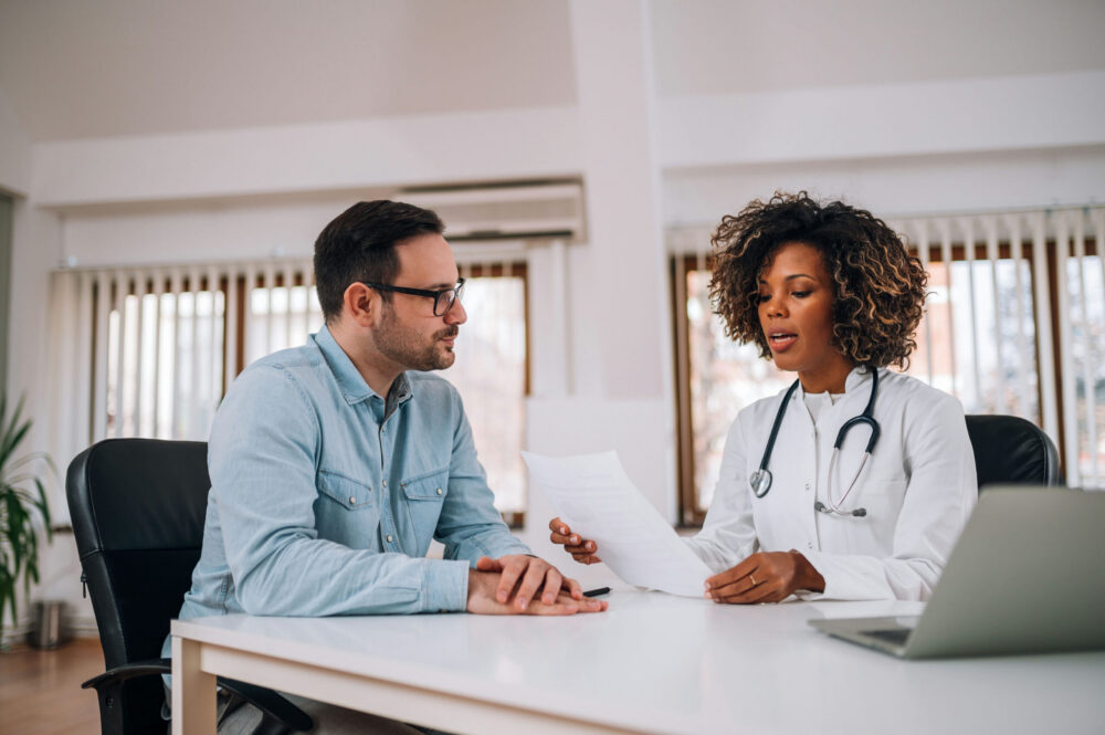 Clinician reviewing paperwork with a patient during fentanyl detox Georgia treatment.