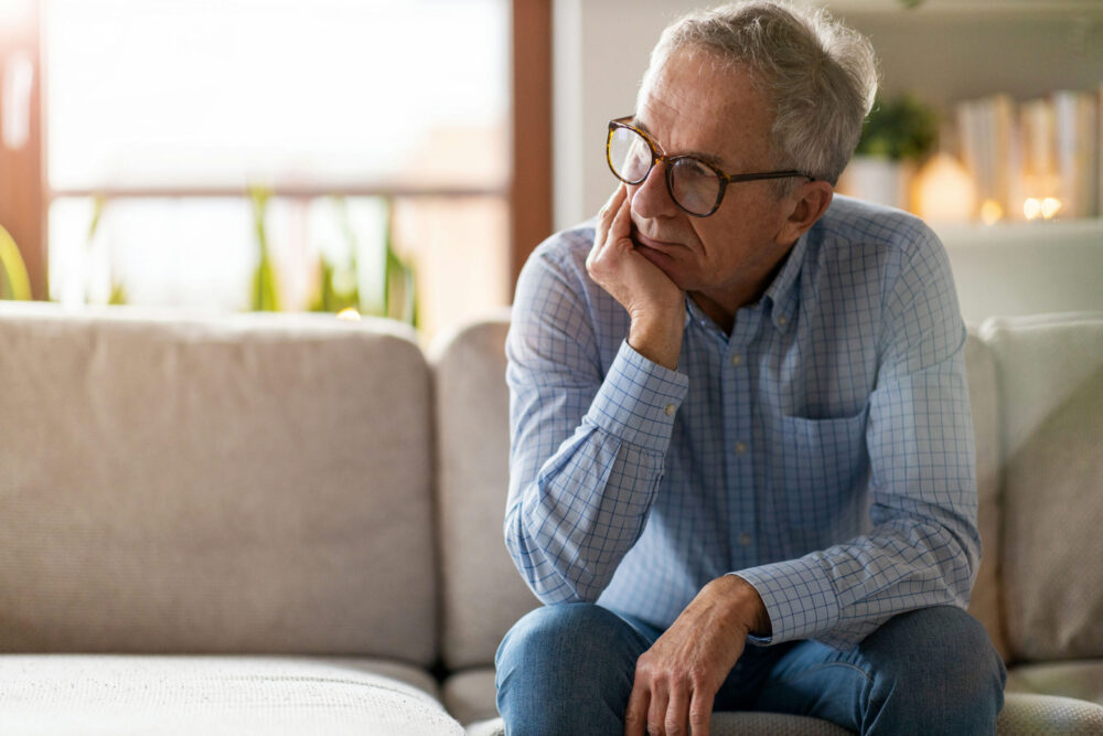 Man sitting thoughtfully while considering fentanyl detox Georgia support.