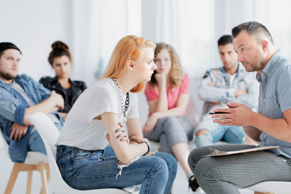 woman receiving guidance in fentanyl detox group therapy