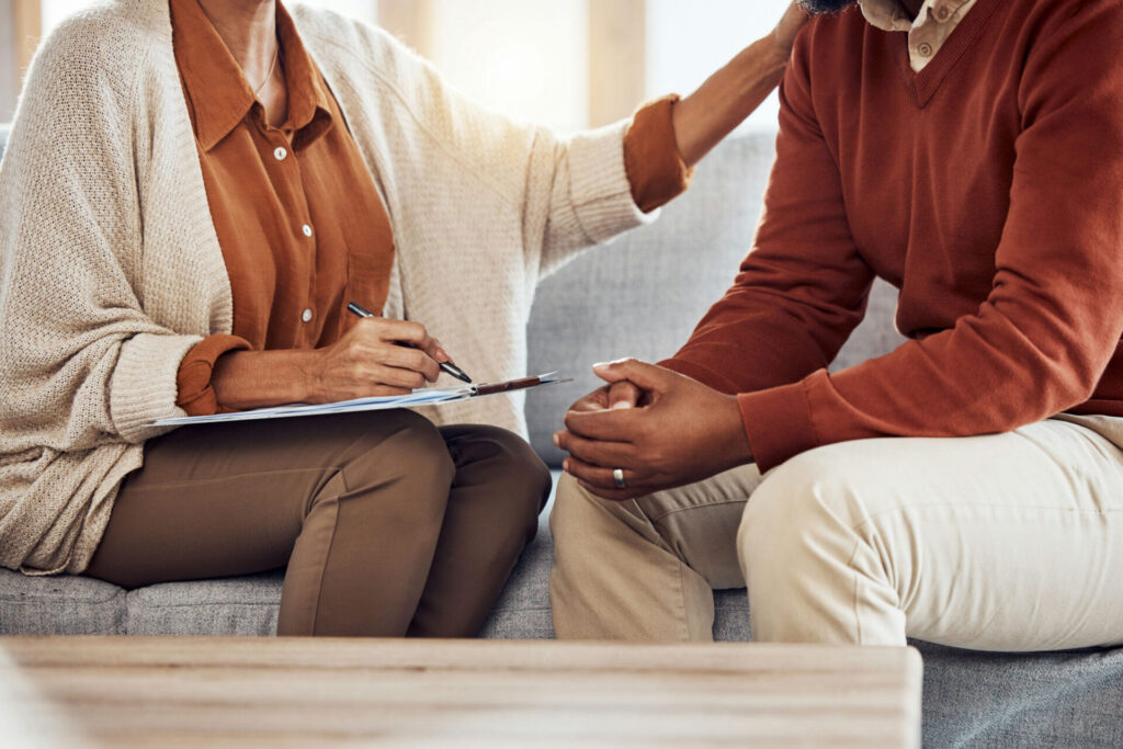 addiction specialist discussing rehab treatment