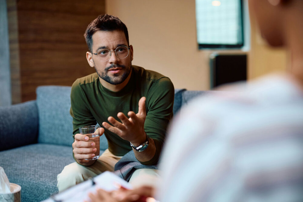 man discussing sobriety fatigue with his counselor