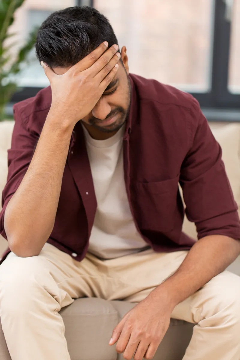 people-crisis-emotions-stress-concept-unhappy-man-suffering-from-head-ache-home
